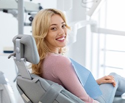 Smiling patient sitting in treatment chair