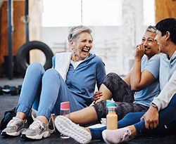 Group of friends smiling in workout class