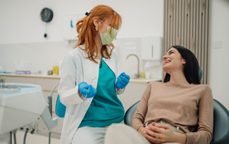 Patient smiling at dentist in treatment chair